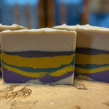 rainbow layers of purple, yellow, green and blue scented with monkey farts