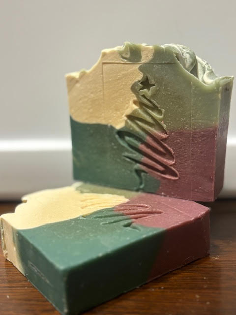Beautiful Holiday Scented goat milk soap in a quilt pattern of white, red and two tones of green 