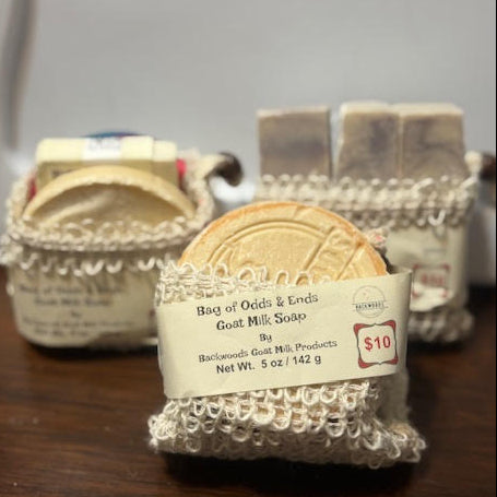 5 oz goat milk soap ends in a variety of scents packaged in a sisal soap saver bag 