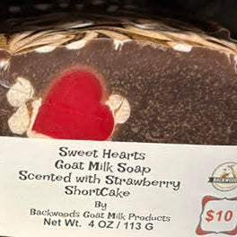 Brown goat milk soap with red heart embed surround  by white