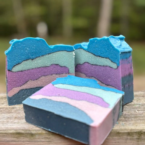 Peach, Magnolia Raspberry scented -5 oz  goat milk soap tipsy blues, green purple and pink layers divided b activated charcoal 