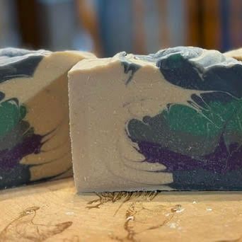 A beautiful White, Purple, Blue, Gray and Teal Side Swept swirled soap with the scent of the sea