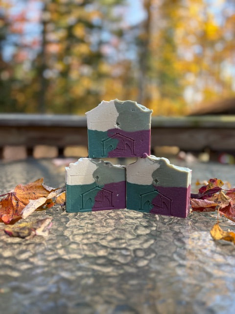white light and dark green, red patchwork design with silver glitter
balsam pine scent